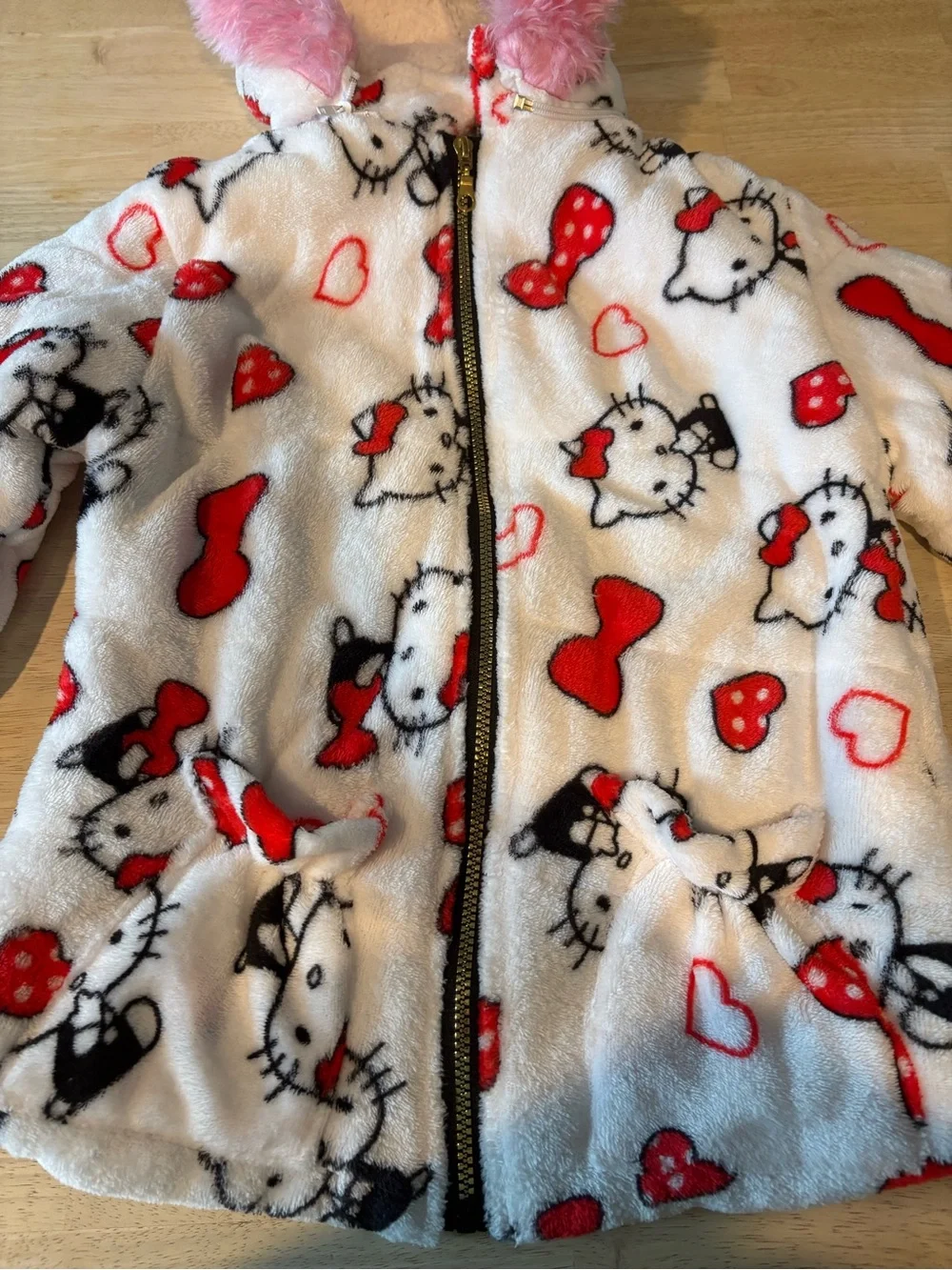Hello Kitty White Plush Zip-Up Hoodie with Red Accents and Pink Fur Hood Trim